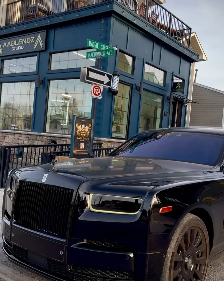 AABlendz Studio storefront with its sign and a black Rolls-Royce out front, 1024 Maggie St SE, Ramsay, Calgary